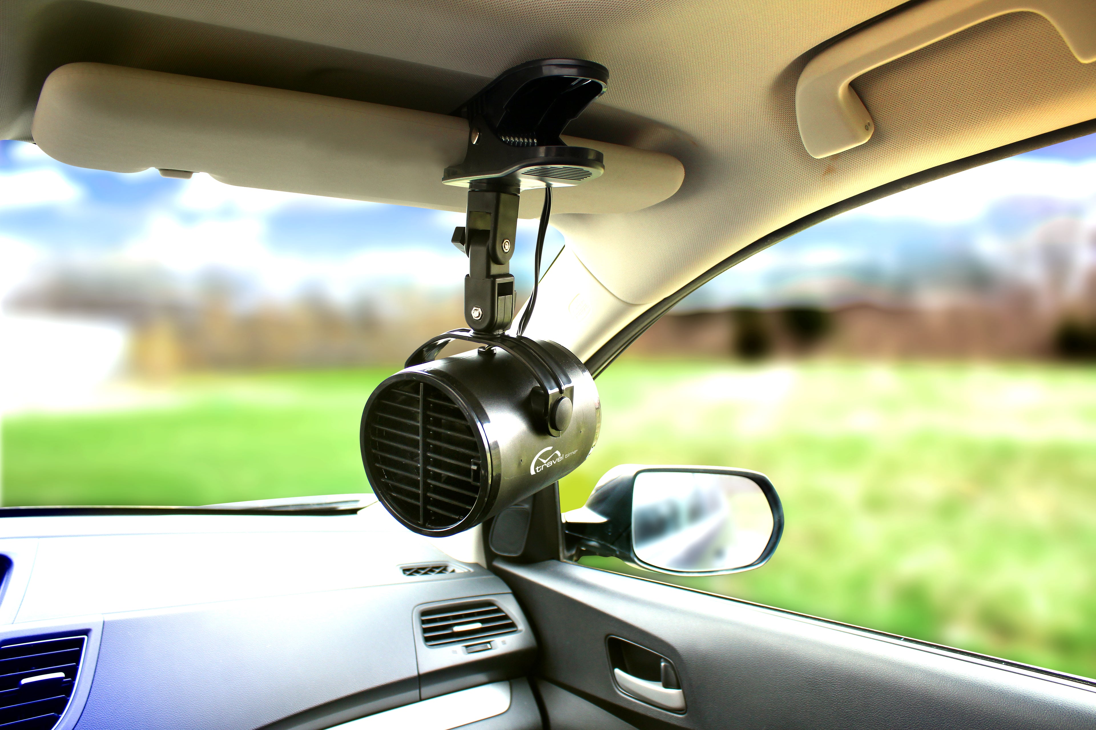 12 Volt Clip-On Turbo Fan clamped to the passenger side visor of a vehicle