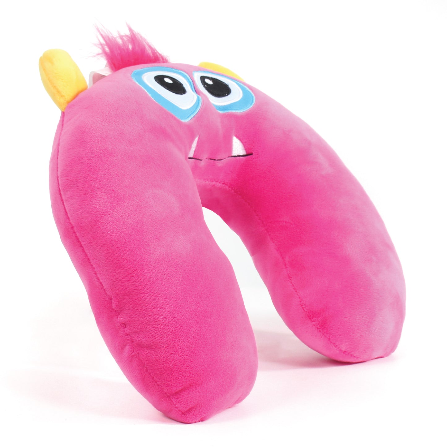 Side view of the Monster Kids' Junior Travel Pillow. This travel neck pillow features a hot pink body, pink hair, and golden horns, as well as embroidered facial features with funky eyes and sharp teeth.