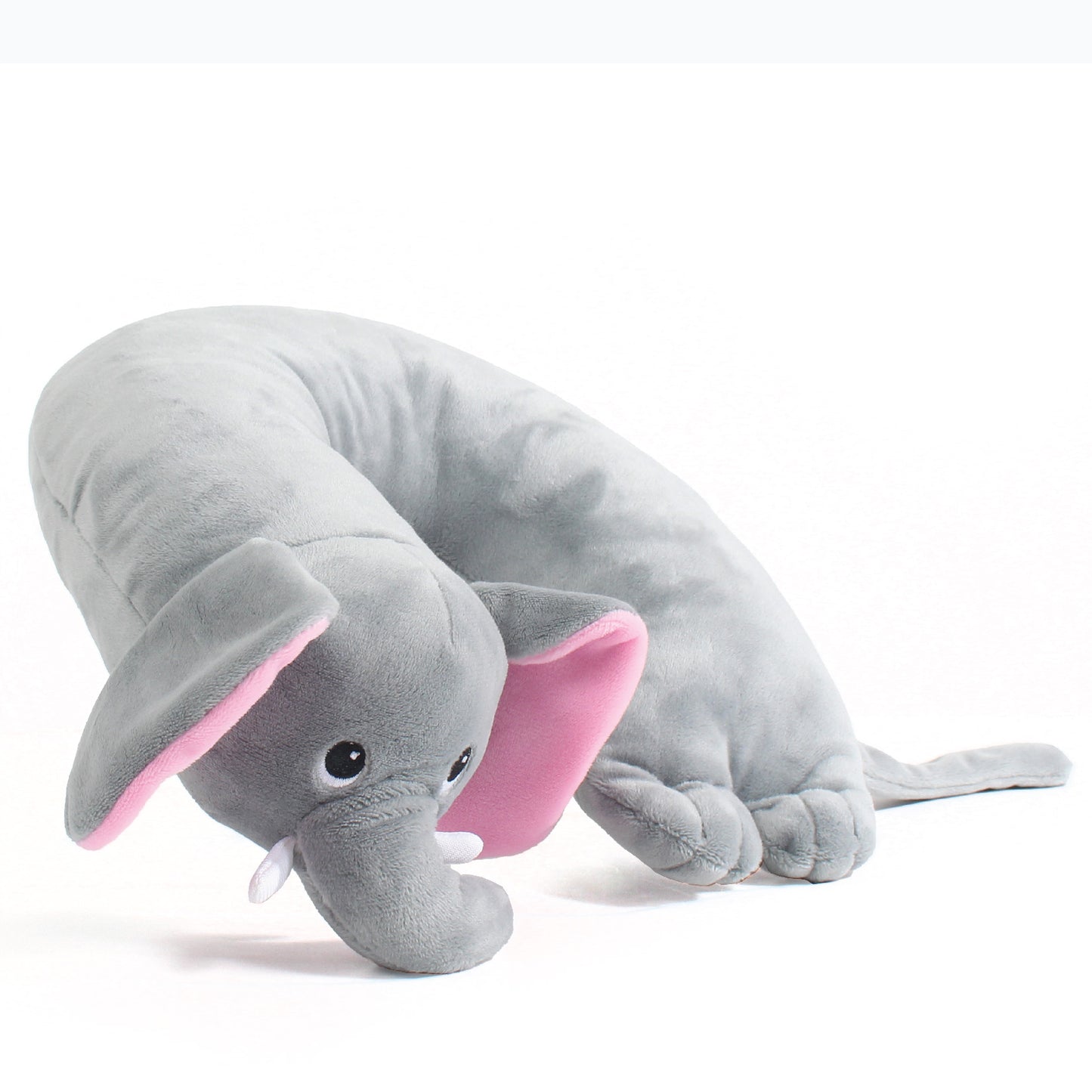 Side view of the Elephant Kids' Junior Travel Pillow. This travel neck pillow features a soft, gray body with embroidered facial features, ears, horns, a trunk, and a long tail.