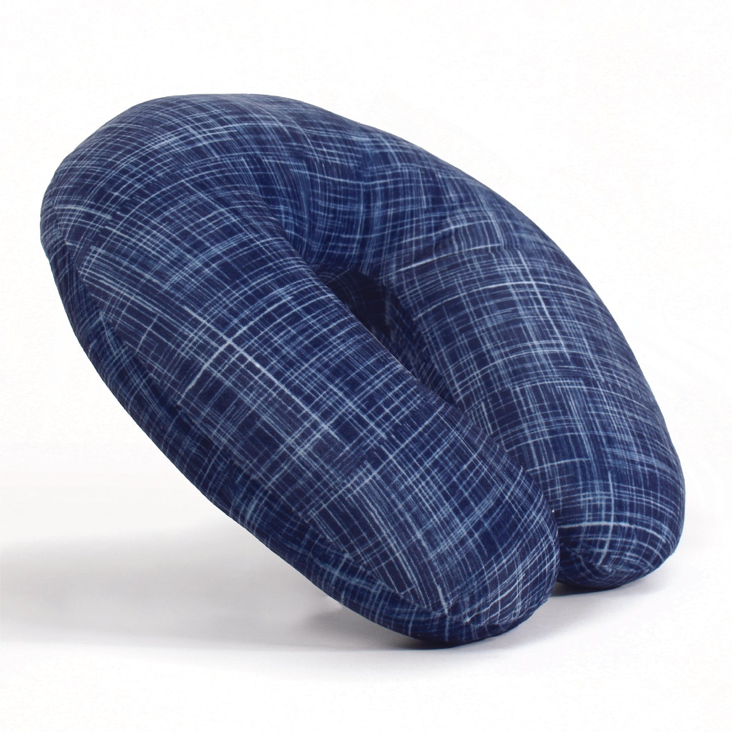Side view of the Plush Travel Neck Pillow in Navy Hatch, which is made of ultra-soft navy, blue, and white cross-hatch fabric.