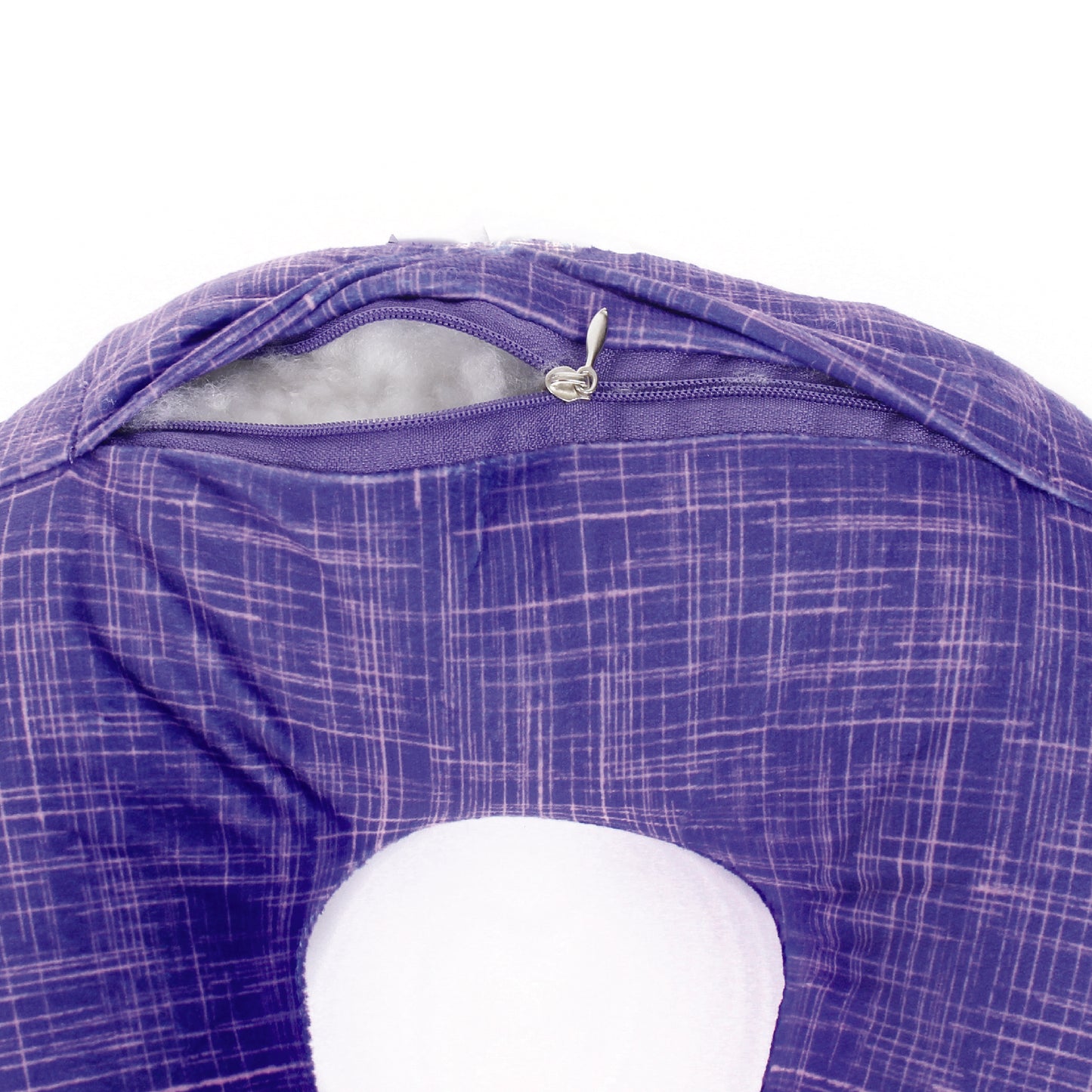 Close up view of the zipper opening on the Plush Travel Neck Pillow in UV Hatch, which is exposing the plush interior inside the pillow's cover.