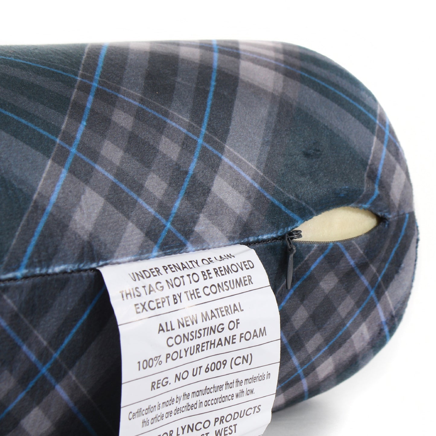 Close up view of the zipper opening on the Memory Foam Roll Travel Pillow in Navy Plaid, which is exposing the plush interior inside the pillow's cover.