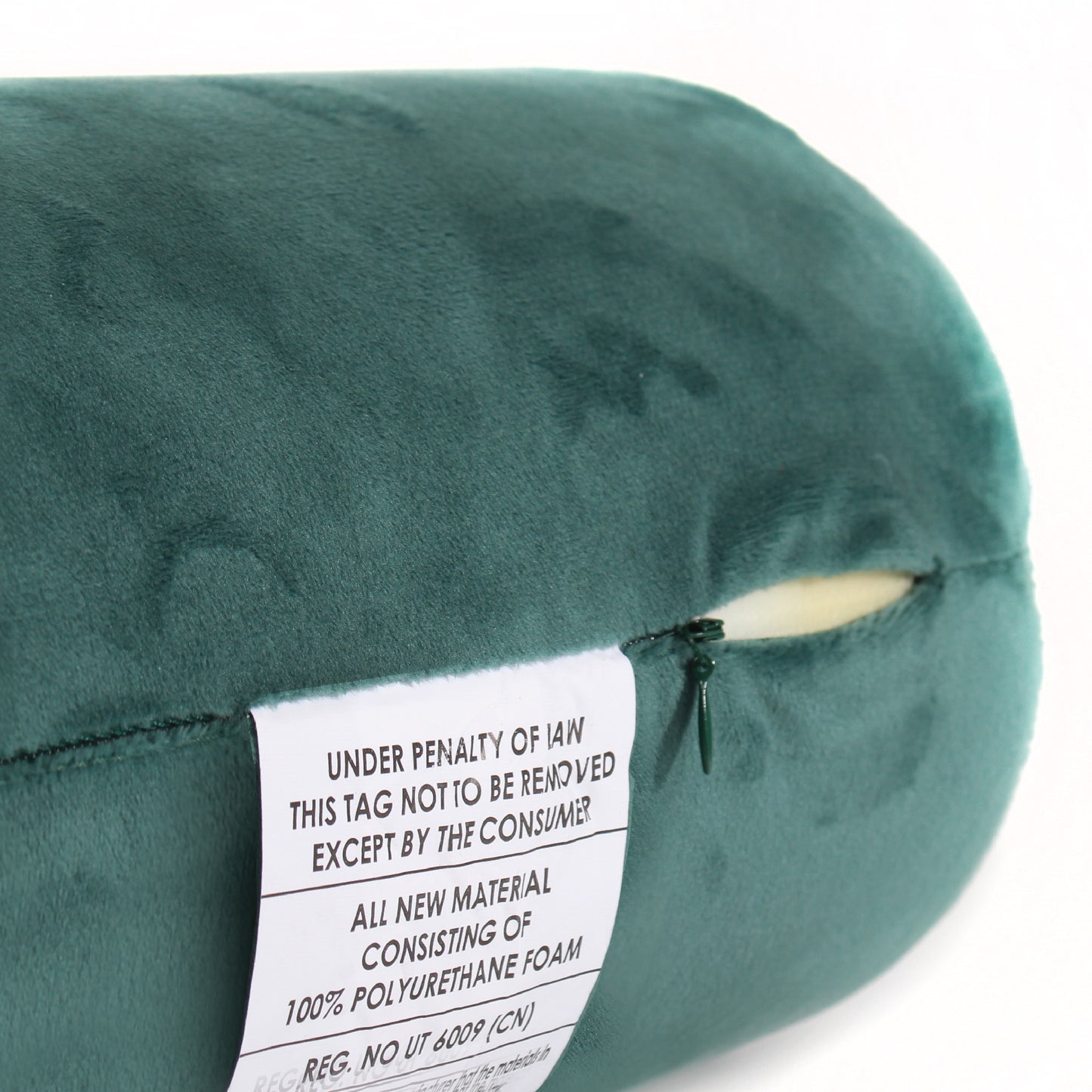 Close up view of the zipper opening on the Memory Foam Roll Travel Pillow in Hunter Green, which is exposing the plush interior inside the pillow's cover.