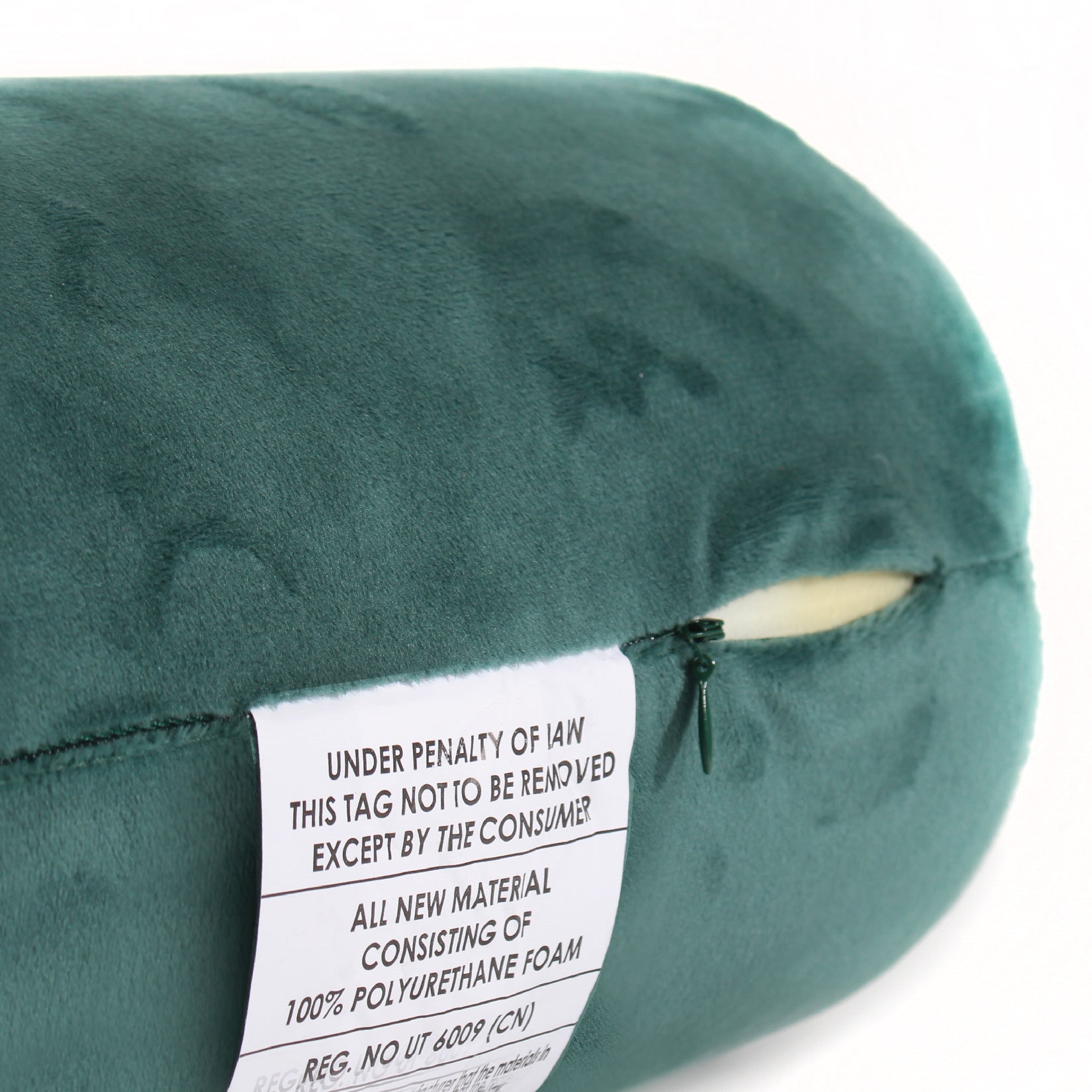 Close up view of the zipper opening on the Memory Foam Roll Travel Pillow in Hunter Green, which is exposing the plush interior inside the pillow's cover.