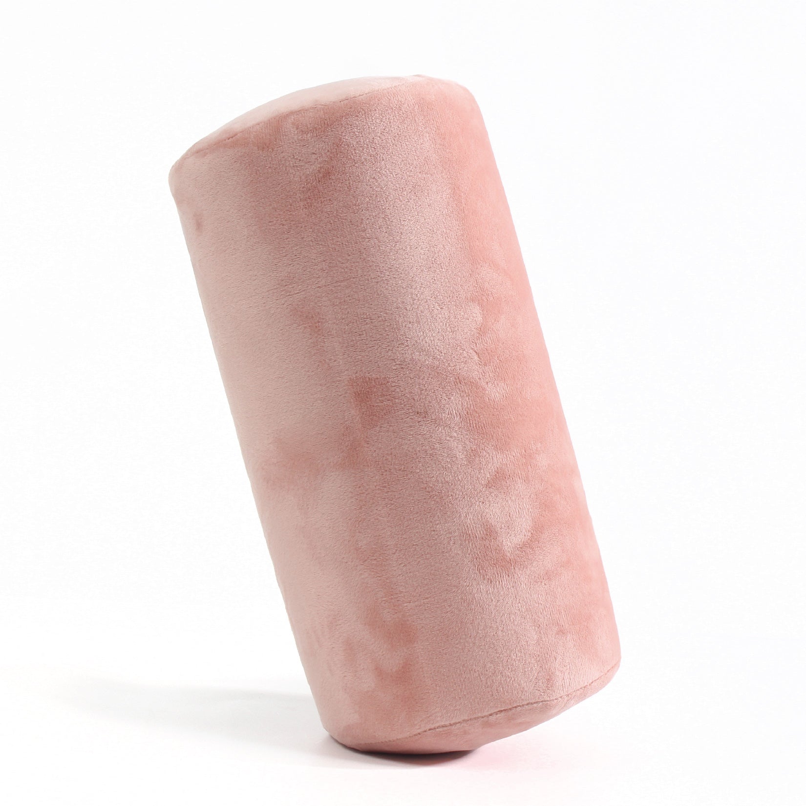 Side view of the Memory Foam Roll Travel Pillow in Pink, which is made of ultra-soft light pink fabric.