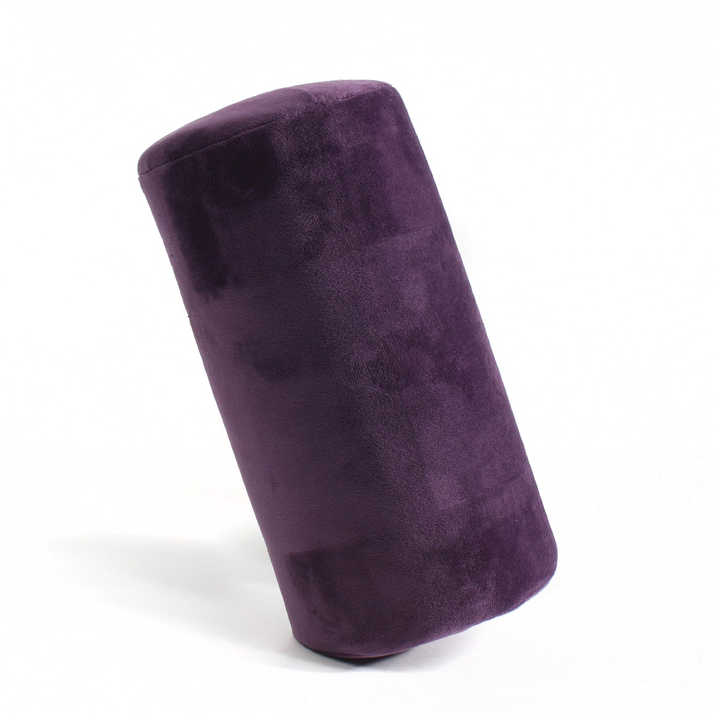 Side view of the Memory Foam Roll Travel Pillow in Purple, which is made of ultra-soft dark purple fabric.