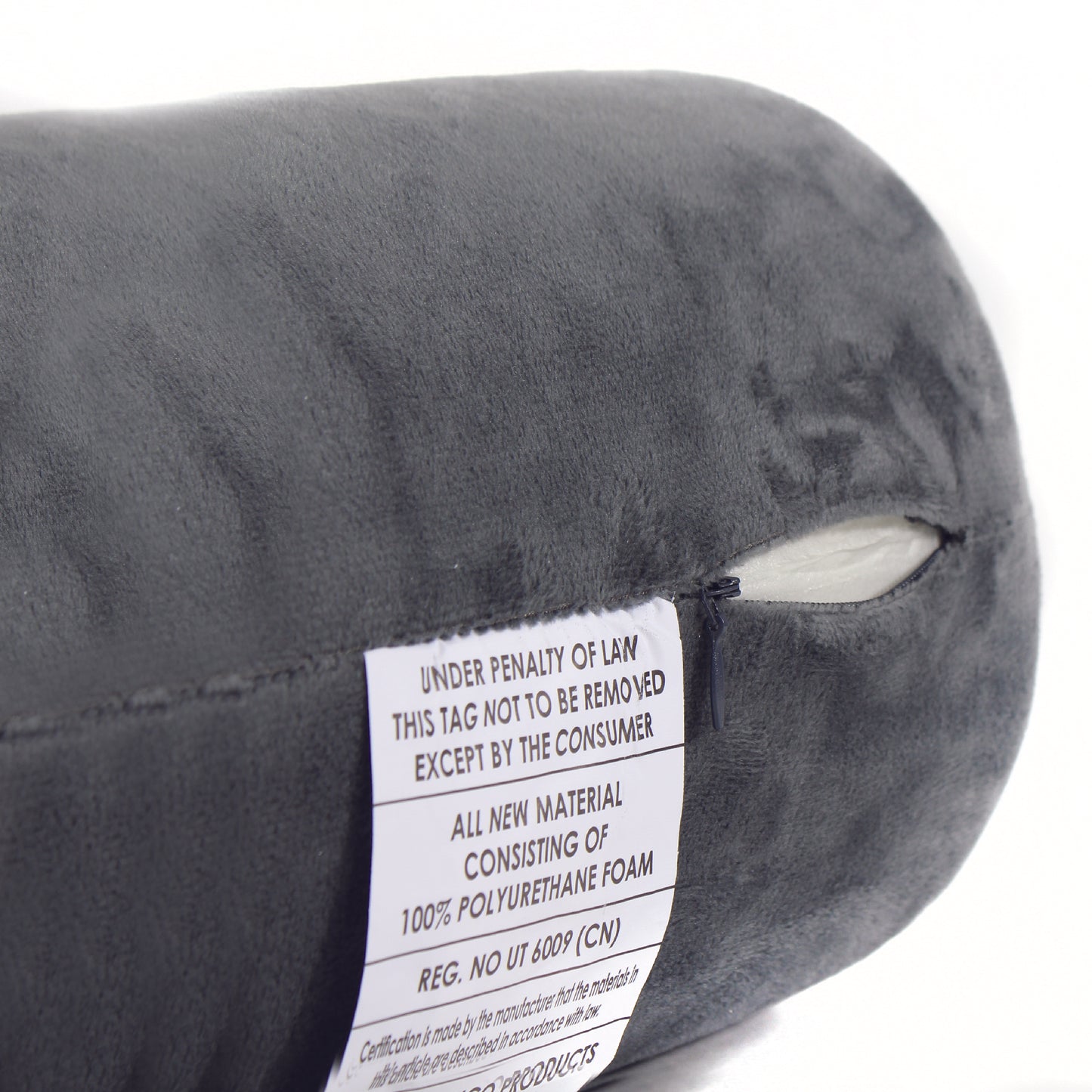 Close up view of the zipper opening on the Memory Foam Roll Travel Pillow in Gray, which is exposing the plush interior inside the pillow's cover.