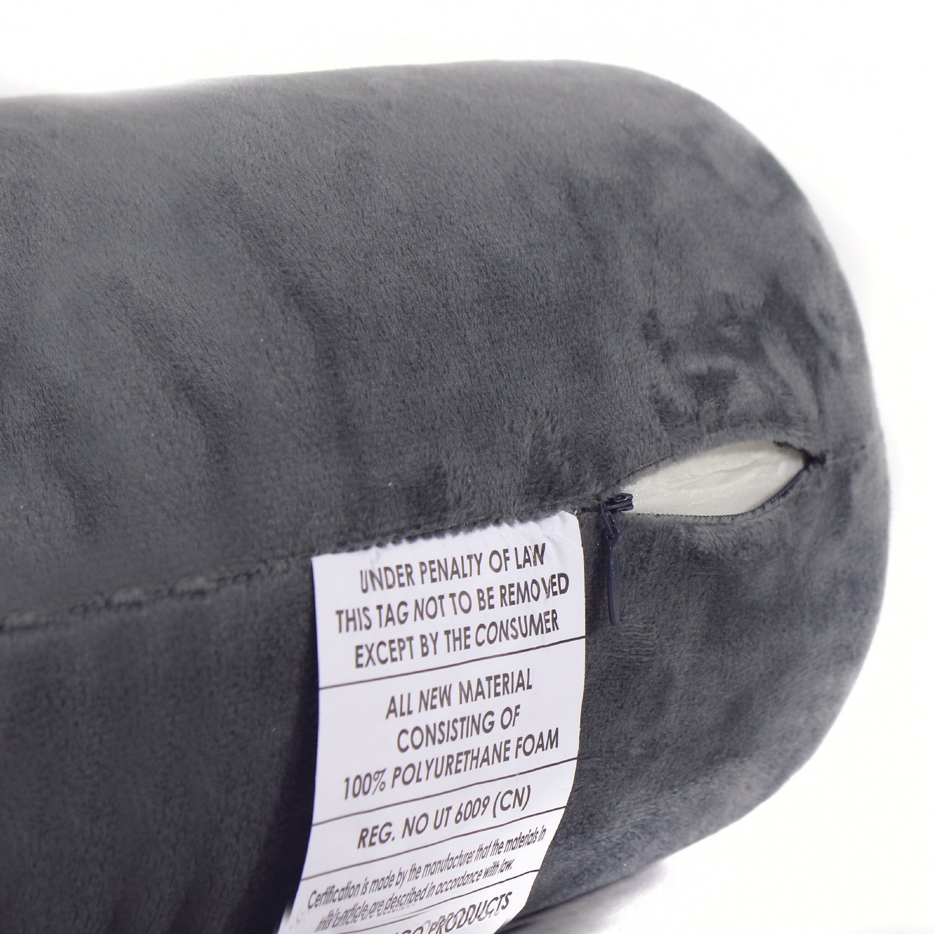 Close up view of the zipper opening on the Memory Foam Roll Travel Pillow in Gray, which is exposing the plush interior inside the pillow's cover.