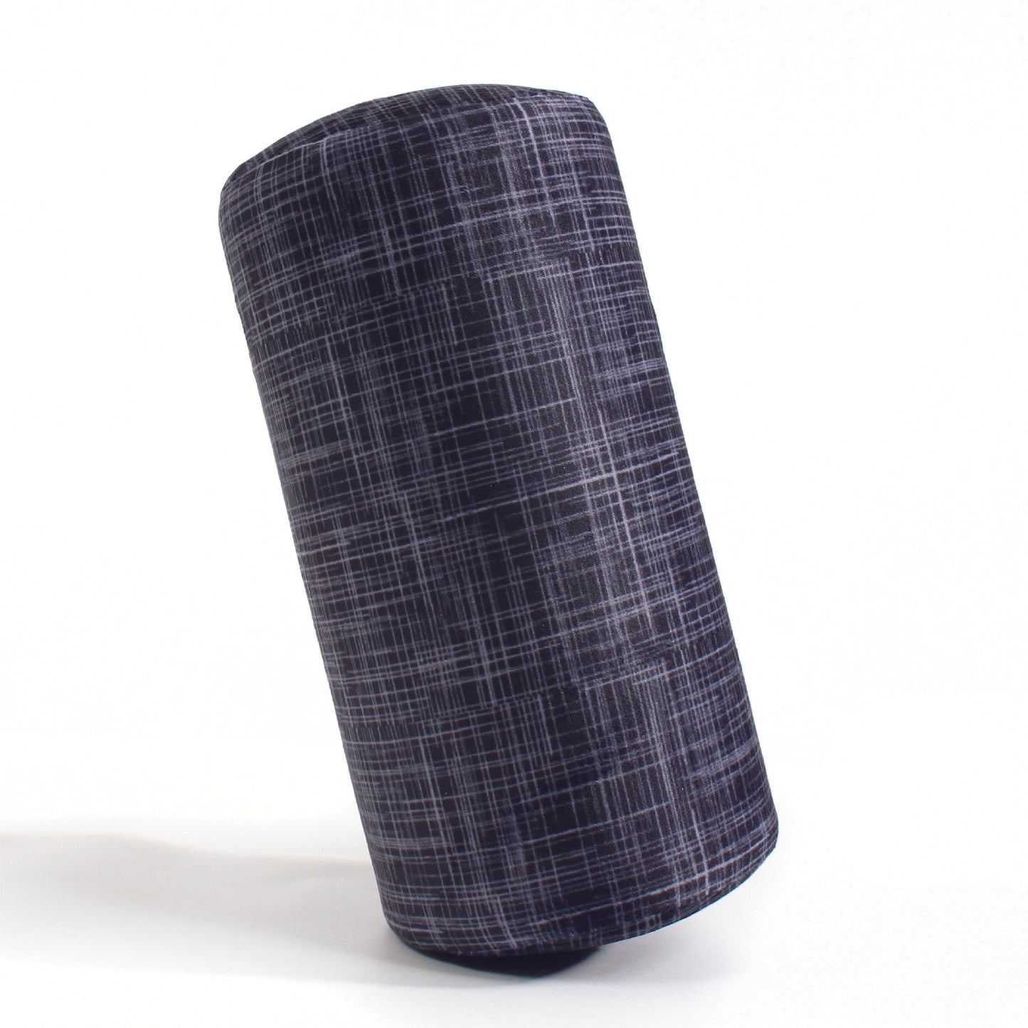 Side view of the Memory Foam Roll Travel Pillow in Black Hatch, which is made of ultra-soft black, gray, and white cross-hatch fabric.