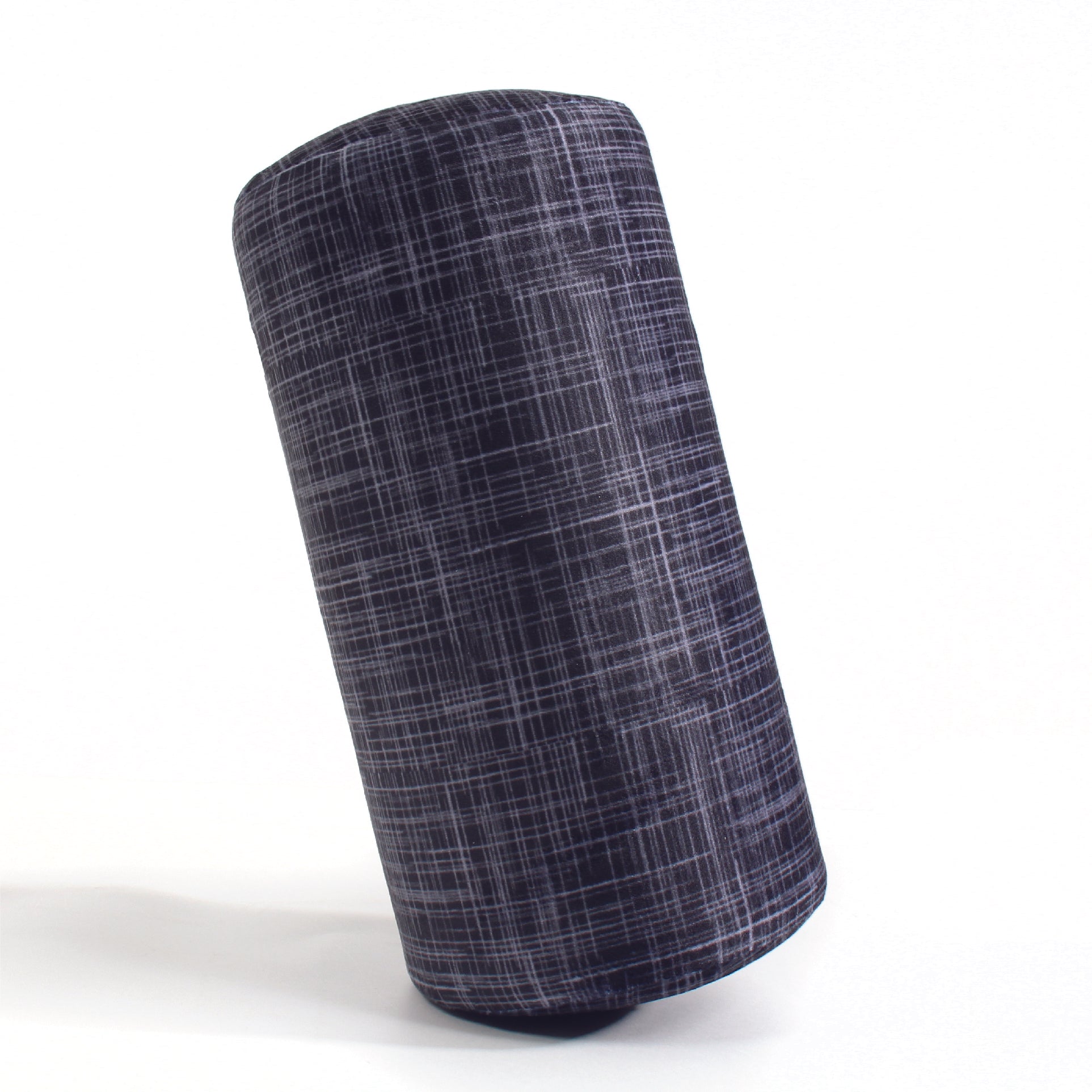 Side view of the Memory Foam Roll Travel Pillow in Black Hatch, which is made of ultra-soft black, gray, and white cross-hatch fabric.
