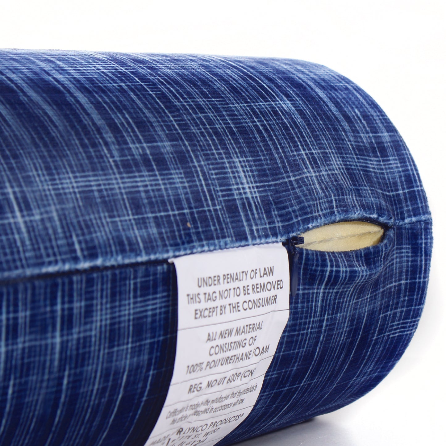 Close up view of the zipper opening on the Memory Foam Roll Travel Pillow in Navy Hatch, which is exposing the plush interior inside the pillow's cover.