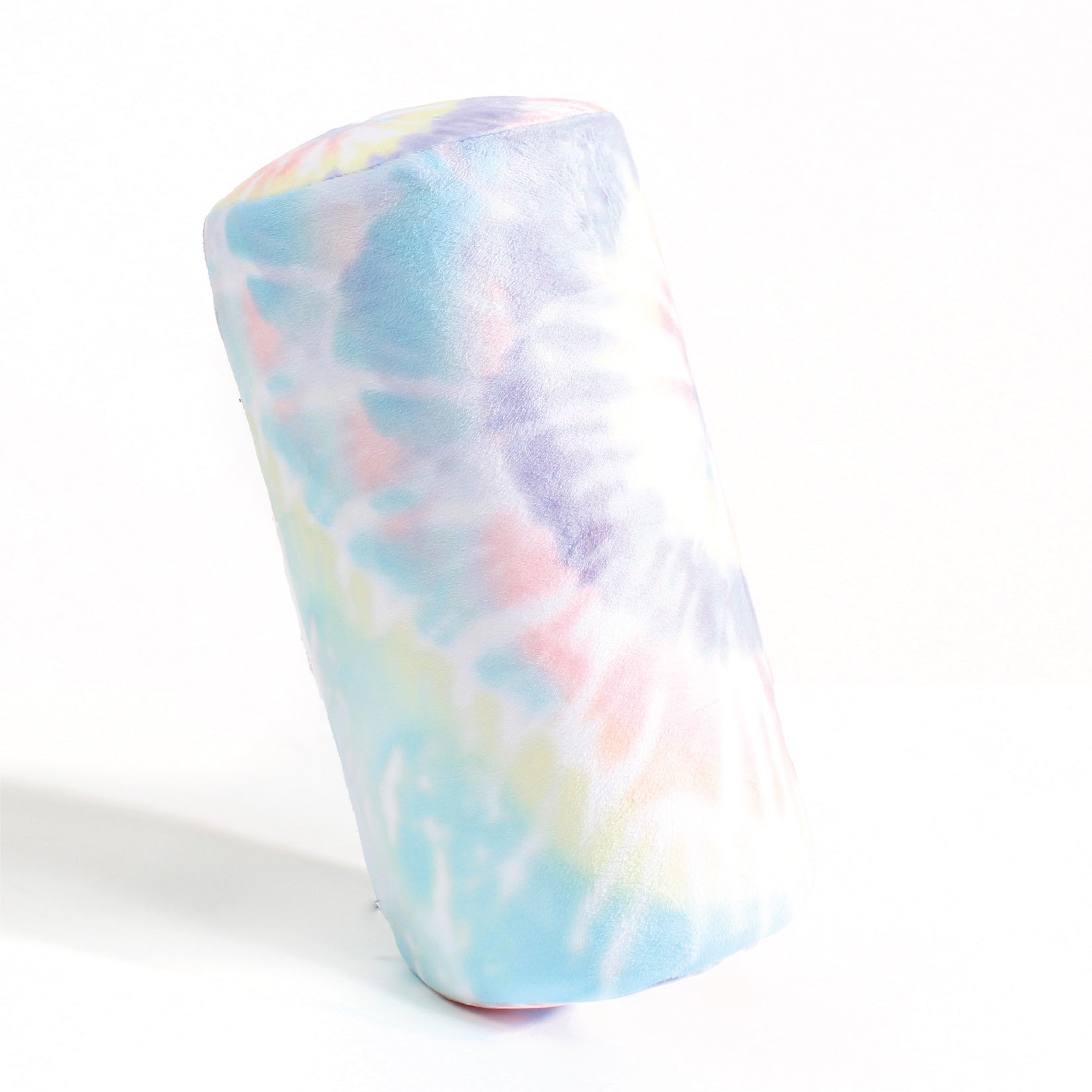 Side view of the Memory Foam Roll Travel Pillow in Multicolor Tie Dye, which is made of ultra-soft rainbow pastel tie dye fabric.
