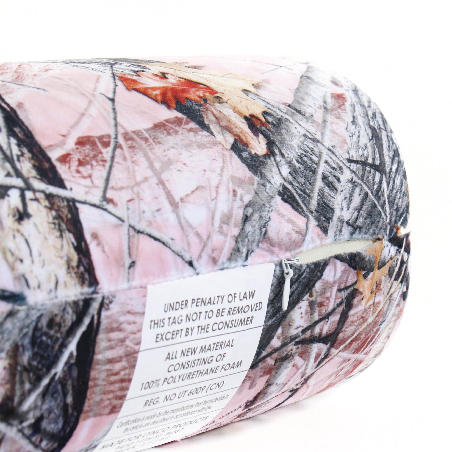 Close up view of the zipper opening on the Memory Foam Roll Travel Pillow in Hunter's Stock Oneshot® Pink Camo, which is exposing the plush interior inside the pillow's cover.