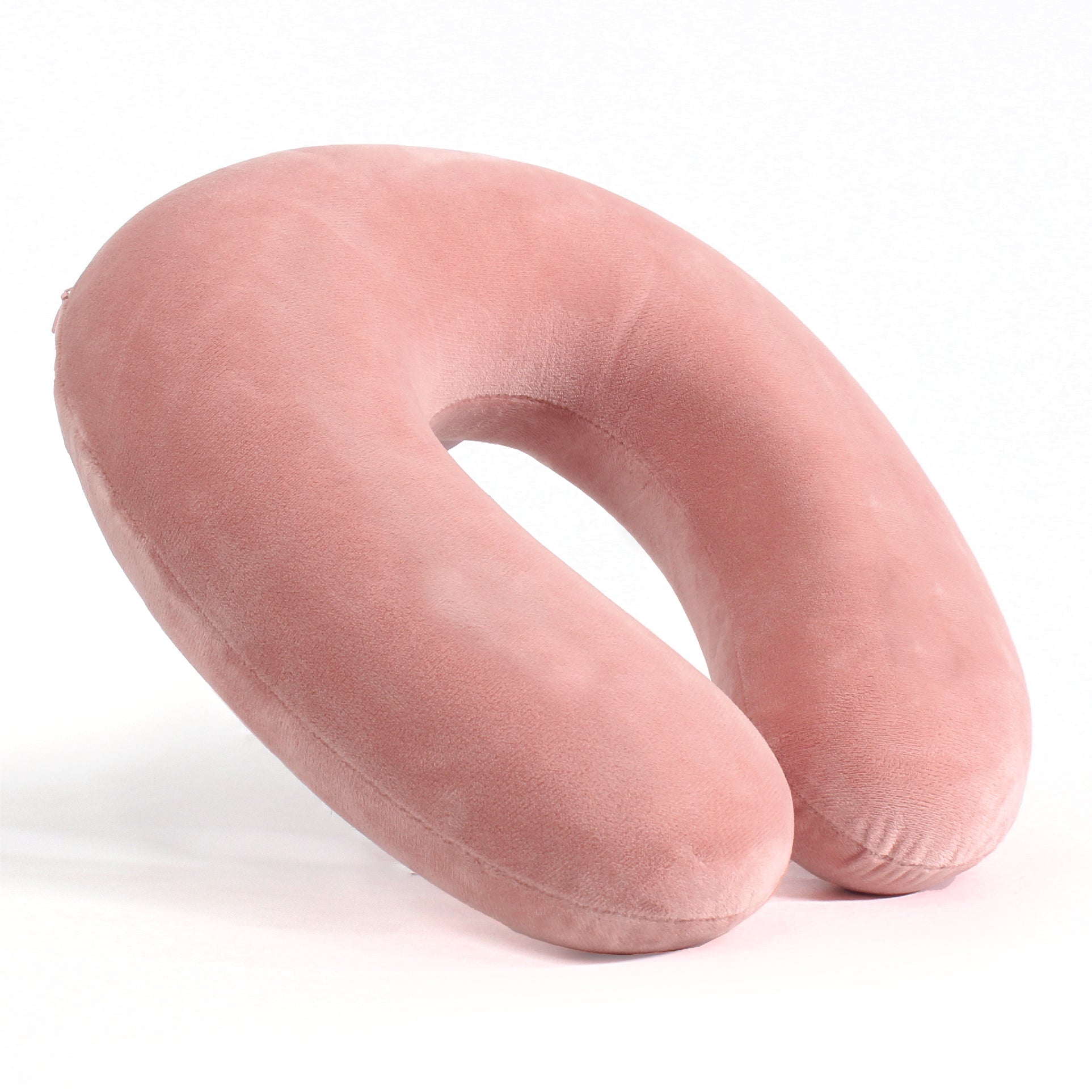 Side view of the Memory Foam Travel Neck Pillow in Pink, which is made of ultra-soft light pink fabric.