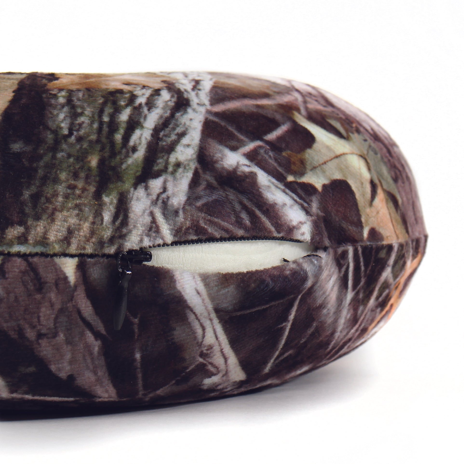 Close up view of the zipper opening on the Memory Foam Travel Neck Pillow in Hunter's Stock Oneshot® Camo, which is exposing the plush interior inside the pillow's cover.