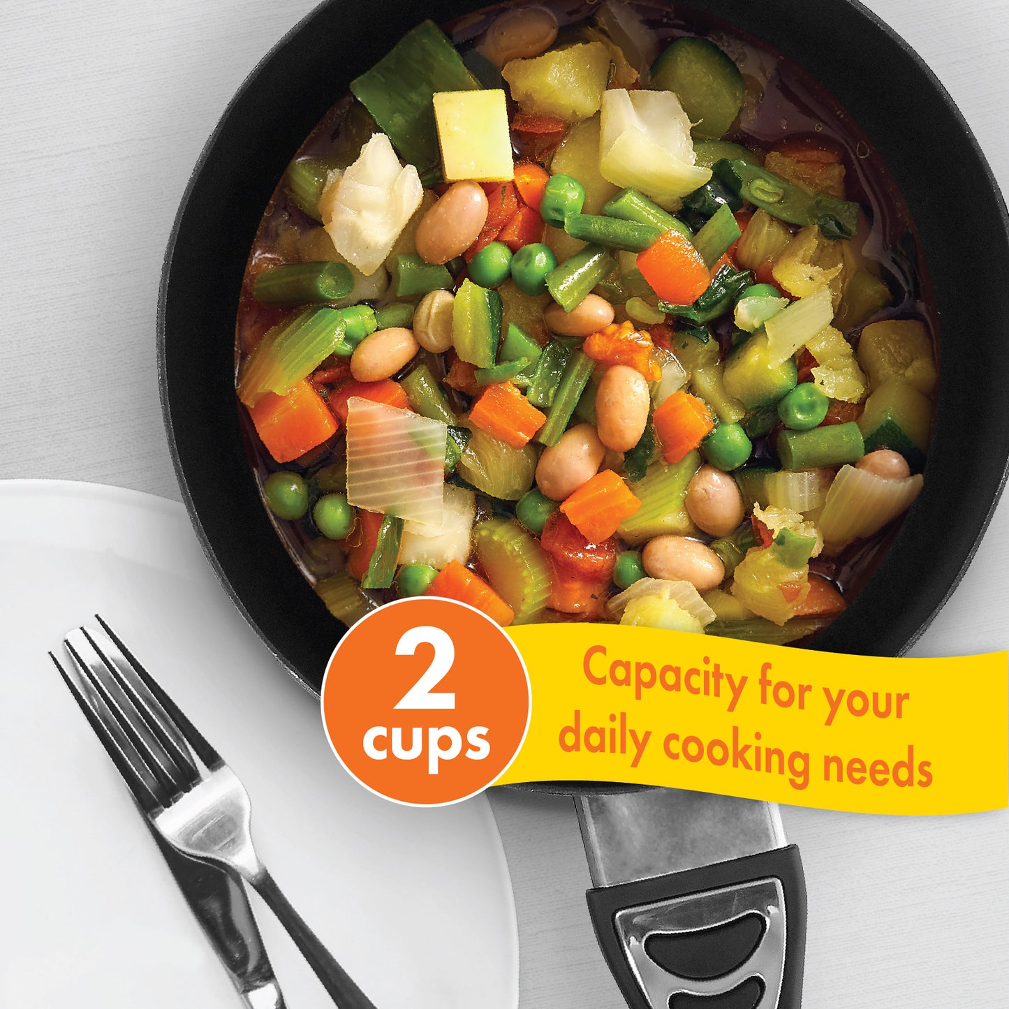 The 12V Cooking Pan with Cover filled with cooked food, which offers a capacity of 2 cups for your daily cooking needs at each meal.