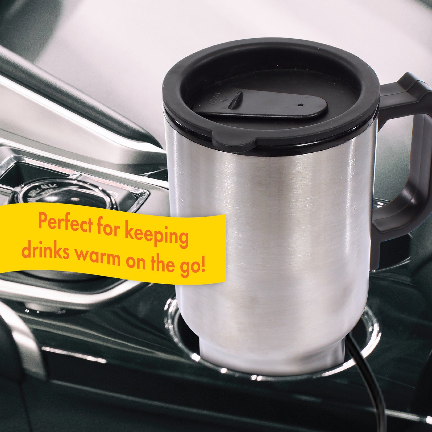 The 12V Warming Travel Mug situated in the cupholder of a vehicle to illustrate that the warming mug is perfect for keeping drinks warm on the go.